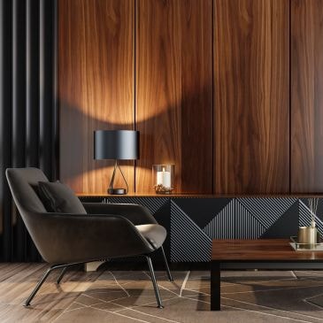 Modern living room corner with a black armchair and wooden accents.